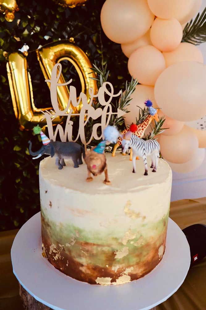 Two Wild party theme birthday cake with animals on top