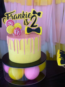 Emma Wiggle party theme yellow birthday cake with a 2 topper