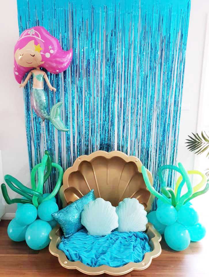 Mermaid theme party props with a giant clam and backdrop