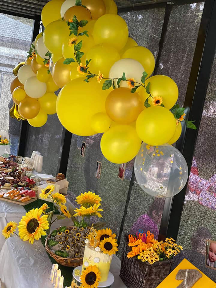 Sunflower party theme set up with balloons and sunflowers