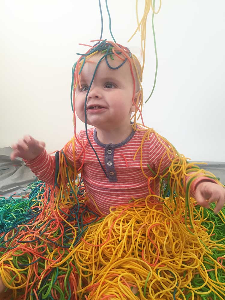 Playing with colourful pasta