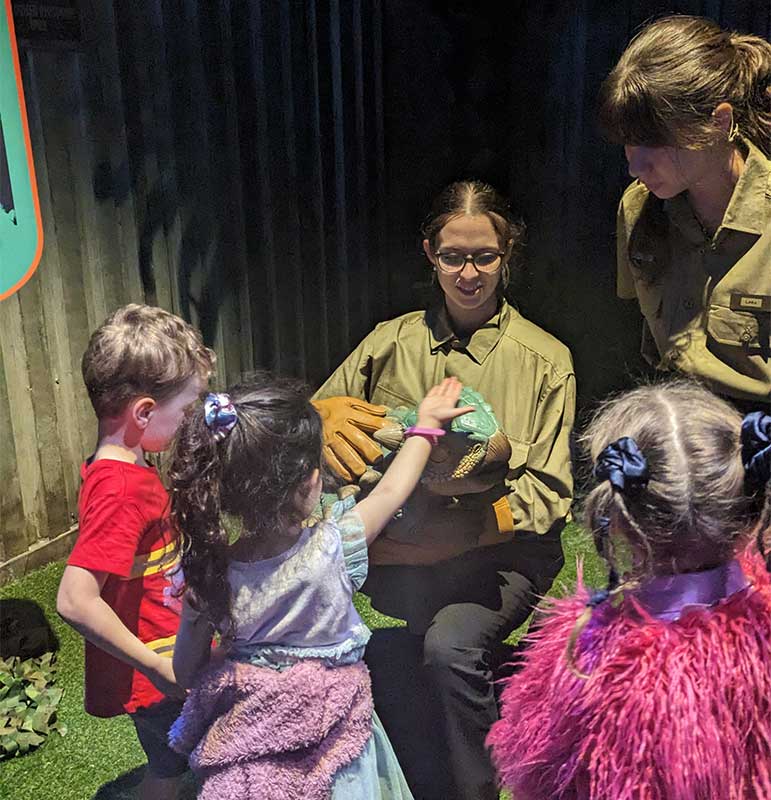 Patting baby dinosaurs